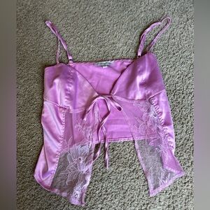 Light pink satan colored tank, with tie in the front.